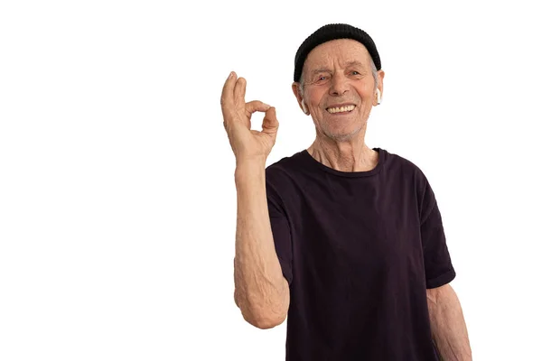 Old funny smiling handsome man in casual clothes posing isolated on white wall background, studio portrait. People sincere emotions lifestyle concept. Mock up copy space. Showing OK gesture — Stock Photo, Image