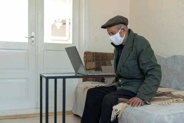 Portrait old man, 70-80 ears old, in medical mask. A concept of the danger of coronavirus for the elderly.