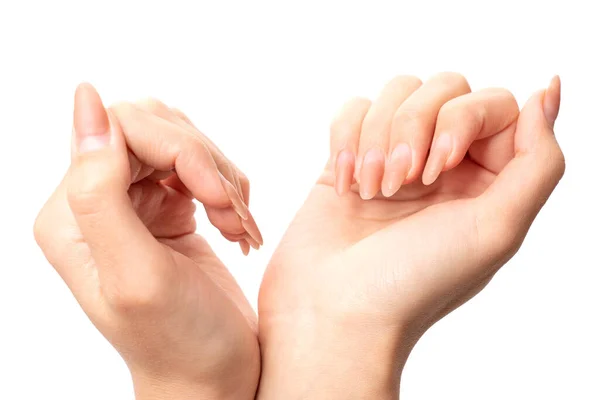 Κοντινό πλάνο δύο θηλυκών χεριών με φυσικό μανικιούρ που απομονώνονται σε λευκό — Φωτογραφία Αρχείου
