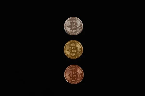 Line of silver, bronze and gold bitcoin coins isolated on black background — Stock Photo, Image