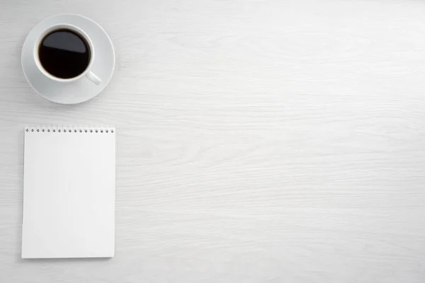 Coffee cup and notepad — Stock Photo, Image