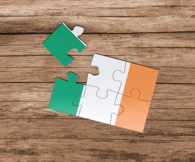 İrlanda ulusal bayrağı yapboz üzerinde. Bir parçası eksik. Tehlike kavramı.