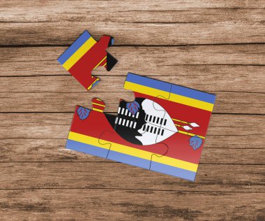 Yapboz üzerinde Svaziland ulusal bayrağı. Bir parçası eksik. Tehlike kavramı.