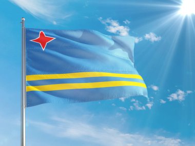 Aruba ulusal bayrağı derin mavi gökyüzüne karşı rüzgarda dalgalanıyor. Kaliteli kumaş. Uluslararası ilişkiler kavramı.