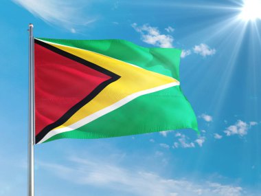 Guyana ulusal bayrağı derin mavi gökyüzüne karşı rüzgarda dalgalanıyor. Kaliteli kumaş. Uluslararası ilişkiler kavramı.