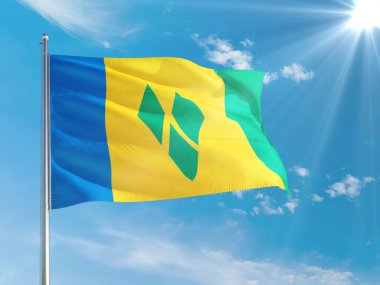 Saint Vincent ve Grenadines Ulusal Bayrağı derin mavi gökyüzüne karşı rüzgarda dalgalanıyor. Kaliteli kumaş. Uluslararası ilişkiler kavramı.