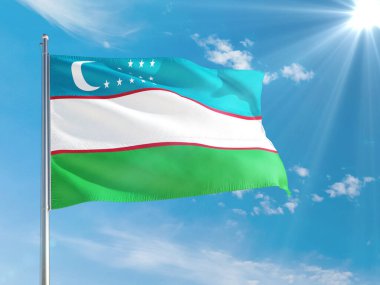 Özbekistan ulusal bayrağı derin mavi gökyüzüne karşı rüzgarda dalgalanıyor. Kaliteli kumaş. Uluslararası ilişkiler kavramı.
