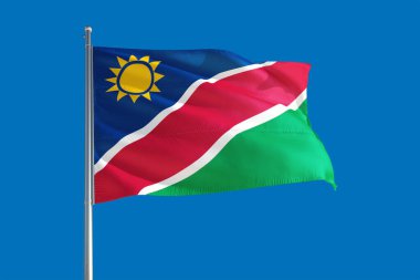 Namibya ulusal bayrağı derin mavi gökyüzünde rüzgarda dalgalanıyor. Kaliteli kumaş. Uluslararası ilişkiler kavramı.