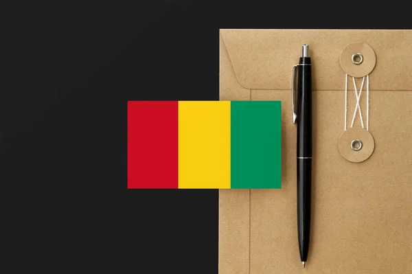 Bandera Guinea Bissau Sobre Carta Envolvente Fondo Bolígrafo Negro Concepto — Foto de Stock