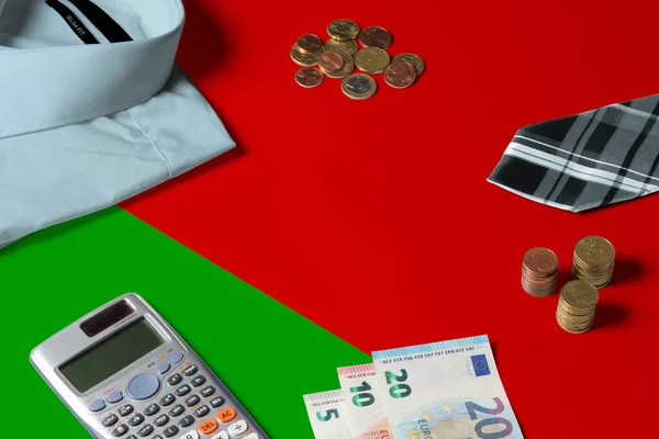 Belarus flag on minimal money concept table. Coins and financial objects on flag surface. National economy theme.