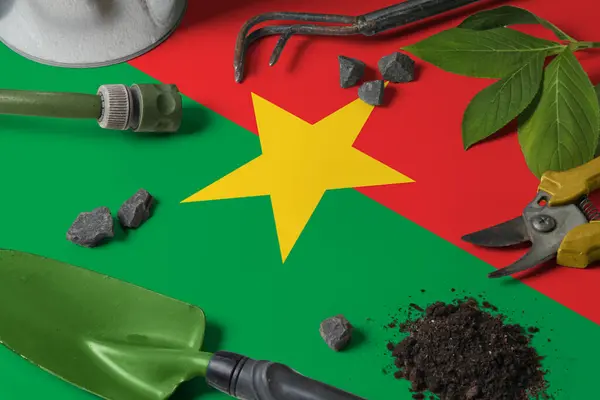 Bandera Burkina Faso Con Herramientas Jardinería Fondo Mesa Primavera Concepto — Foto de Stock
