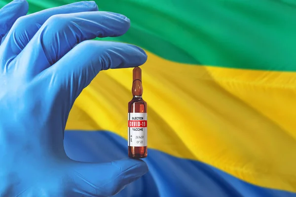 Gabon Flag Coronavirus Covid Concept Doctor Blue Protection Medical Gloves — Stock Photo, Image