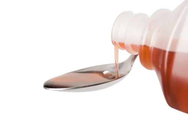 Pouring Cough Medicine on spoon - Focus on pour — Stock Photo, Image