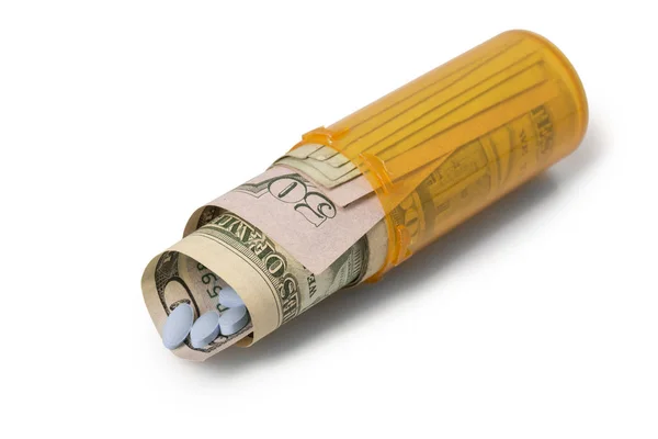 Money and pills rolled up in Prescription container - Laying dow — Stock Photo, Image