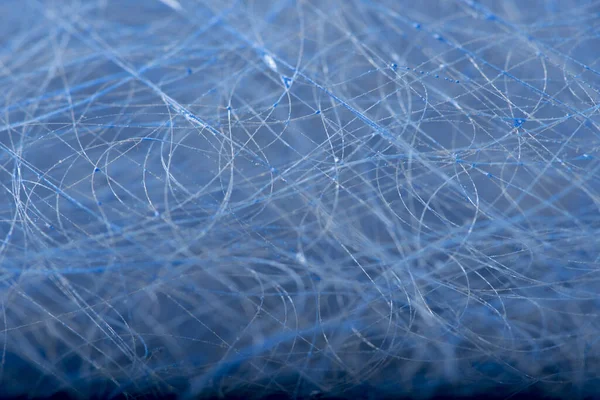 Closeup shot of a dusty furnace filter forming an abstract pattern.