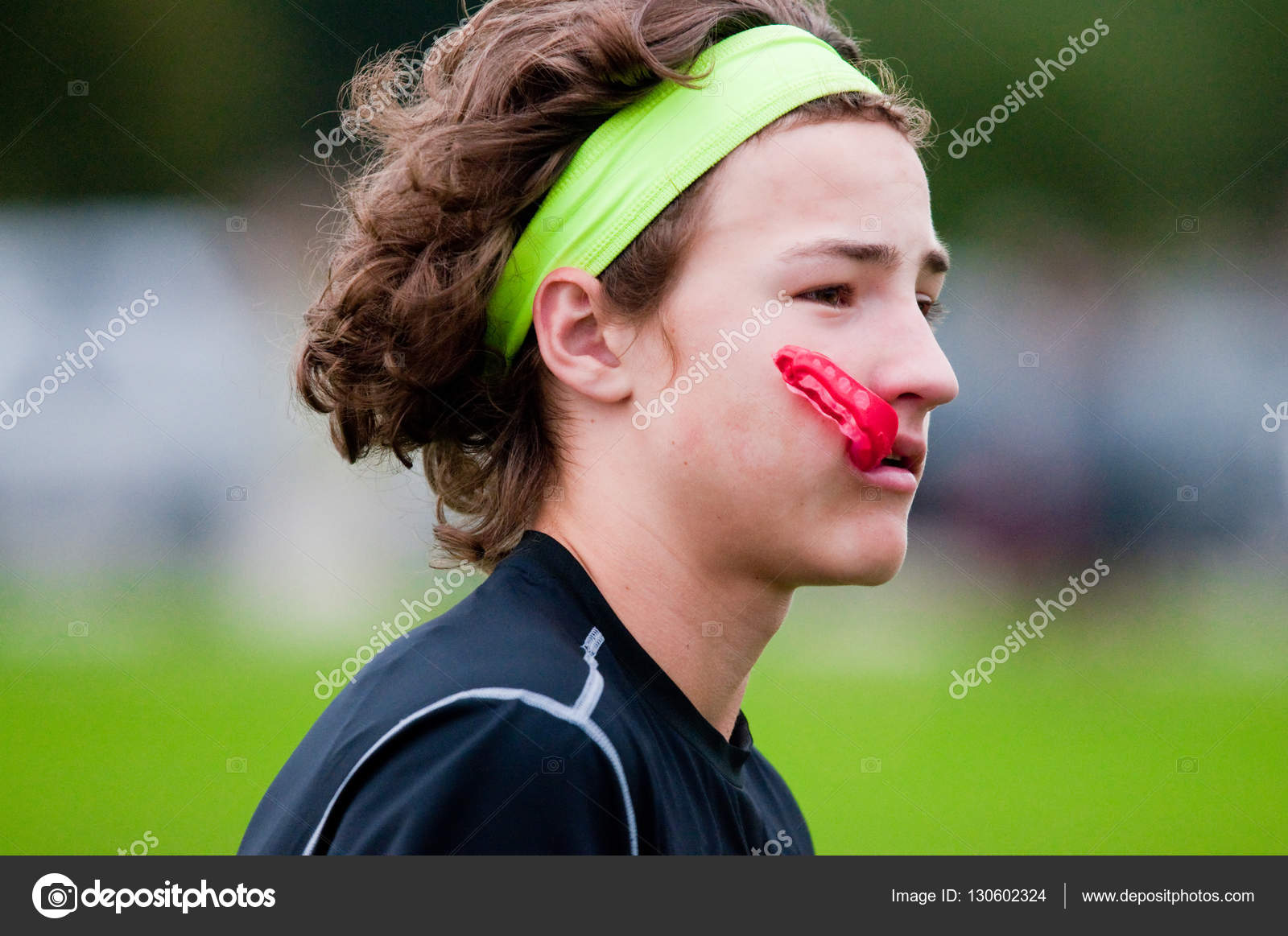 Youth football boy with long hair Stock Photo by ©tammykayphoto 130602324 Youth football boy with long hair Stock Photo by ©tammykayphoto 130602324