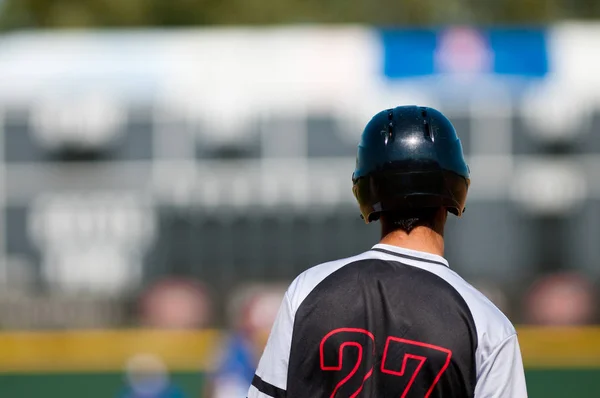 Hispanic high school player on base — Stock Photo, Image