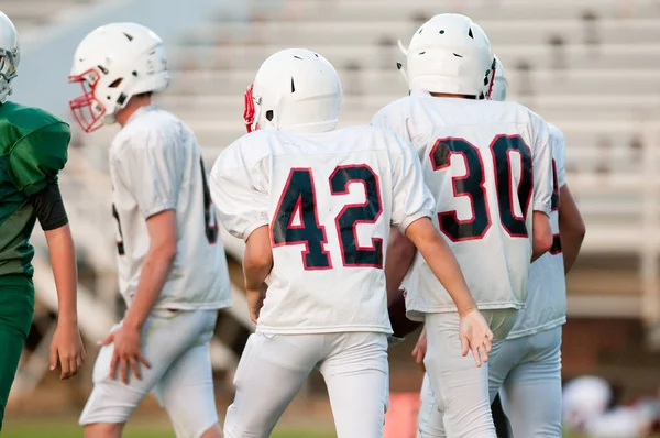 Youth football players during a game. — Stock Photo, Image