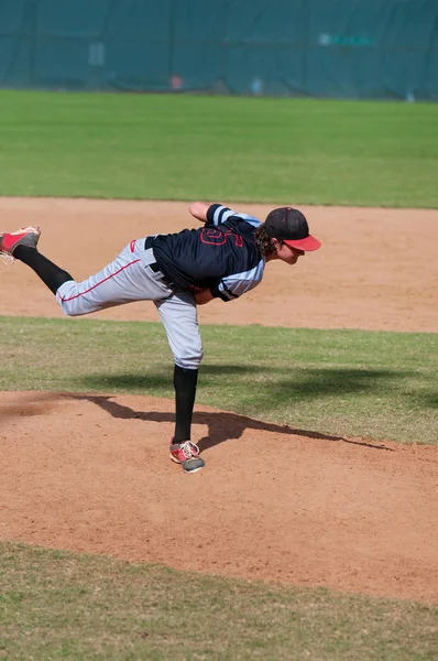 Little league baseball pitcher on the mound