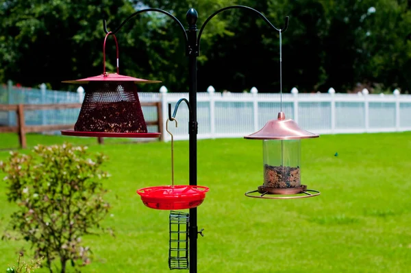 Three bird feeders outdoors — Stock Photo, Image