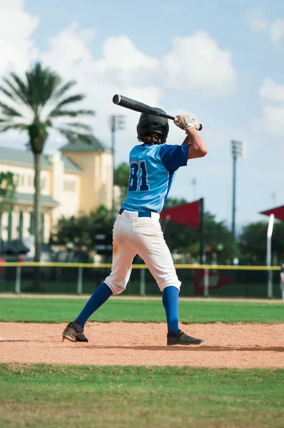 A batter about to hit a pitch during a baseball game — Stock Photo, Image