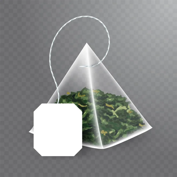 Πυραμίδα σχήμα σακουλάκι τσαγιού mock up με πράσινο τσάι στο εσωτερικό. Διάνυσμα ρεαλιστική απεικόνιση του φακελάκι τσαγιού με άδειο λευκό ετικέτα απομονώνονται σε διαφανές φόντο. — Διανυσματικό Αρχείο