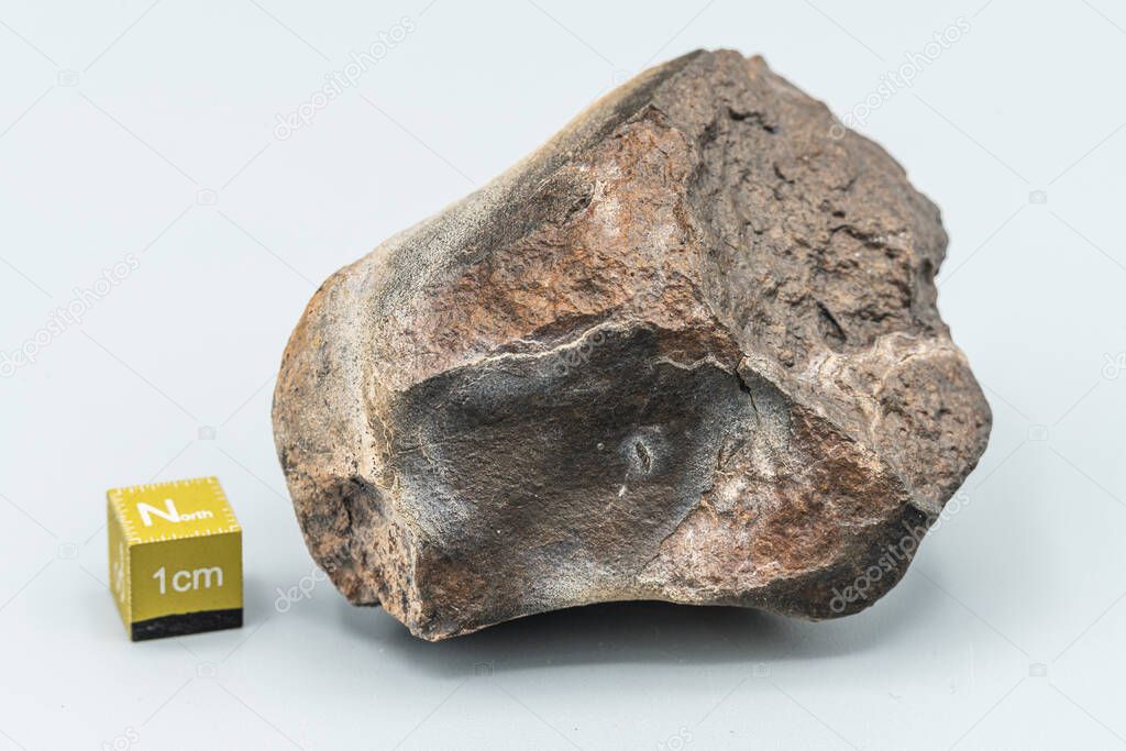 closeup view, piece of meteorite isolated on white background