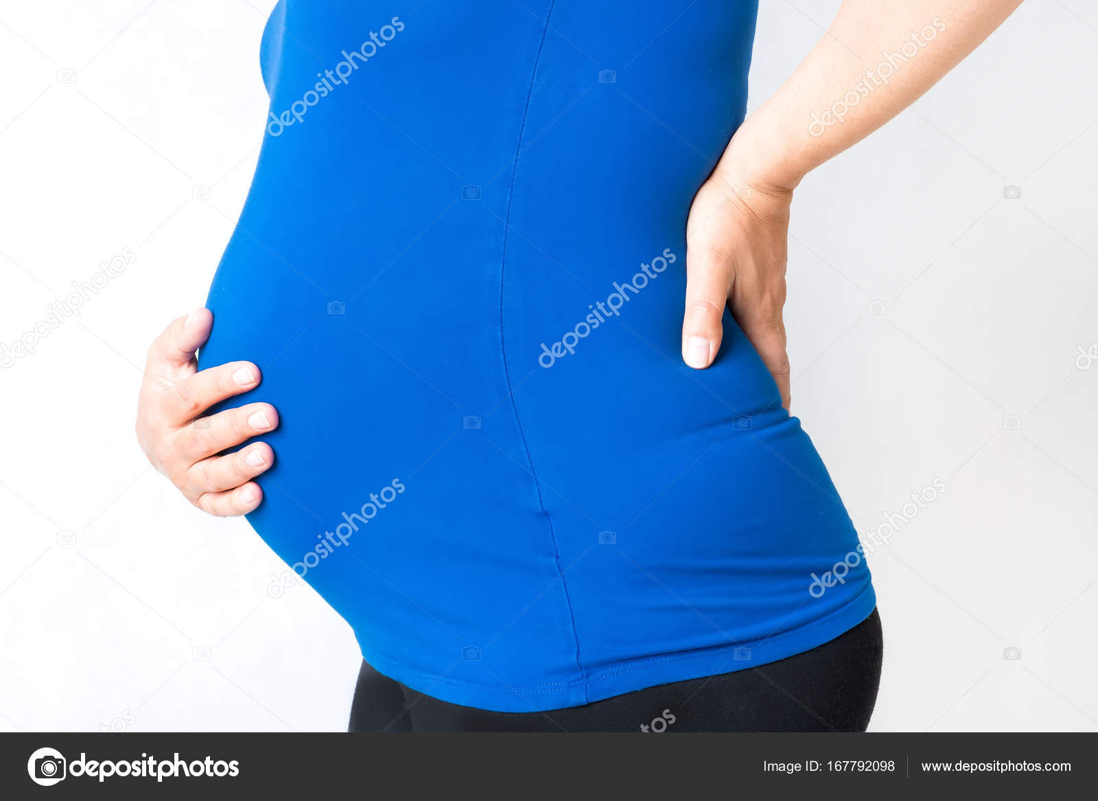 Mujer Embarazada Las Manos En Su Vientre Y La Espalda Foto