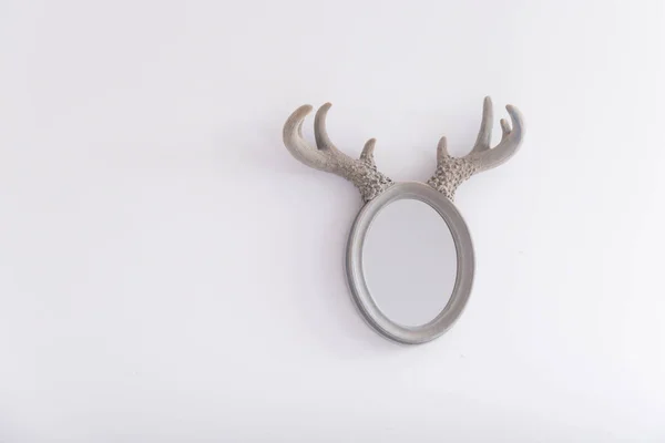 Oval mirror with horns — Stock Photo, Image