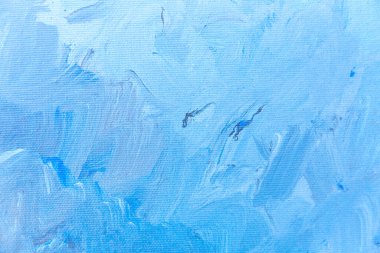 Arkaplan olarak fırça darbeleri ile mavi boyalı tuval