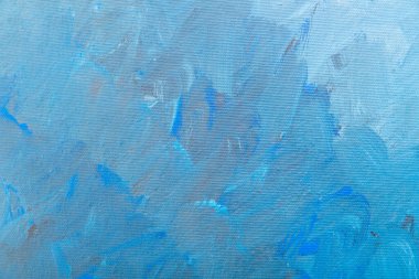 Arkaplan olarak fırça darbeleri ile mavi boyalı tuval