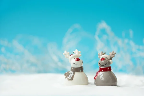 Two Ceramic Christmas Reindeer Toy Snowy Background Christmas New Year — Stock Photo, Image