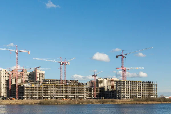 Construction of apartment buildings, cranes and concrete. Panorama