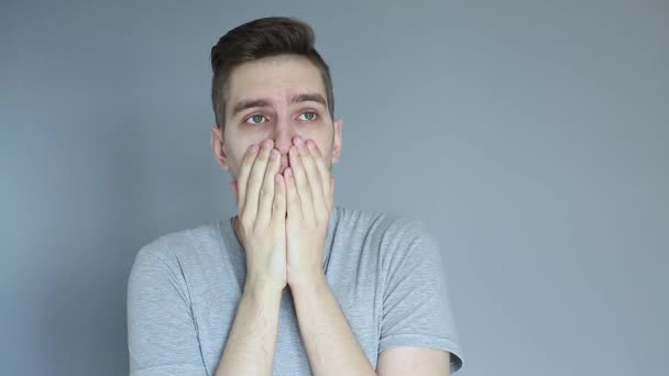 Young Shocked Man Grey Background Holding His Hand Hand Head — Stock Video