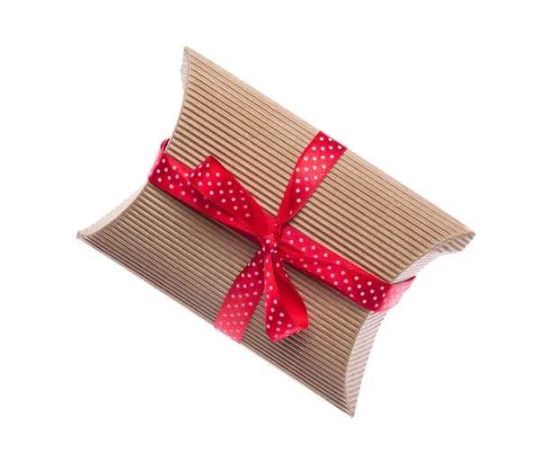 Brown gift box with red ribbon isolated on white — Stock Photo, Image