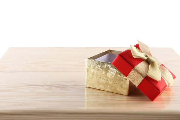 Empty gift box on wooden table — Stock Photo, Image