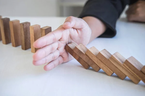 Risk and Strategy in Business, Image of hand stopping falling co — Stock Photo, Image