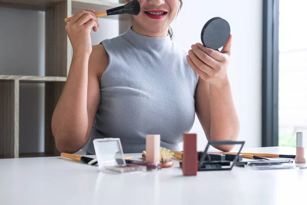 Elegant female Beauty blogger showing testing beauty cosmetic us