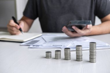 Cal hesap makinesi kullanarak sikke yığını ve Koca istifleme Görüntüleri