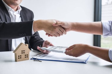 Image of successful deal of real estate, Broker and client shaki