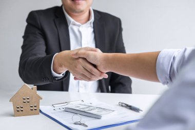Image of successful deal of real estate, Broker and client shaki