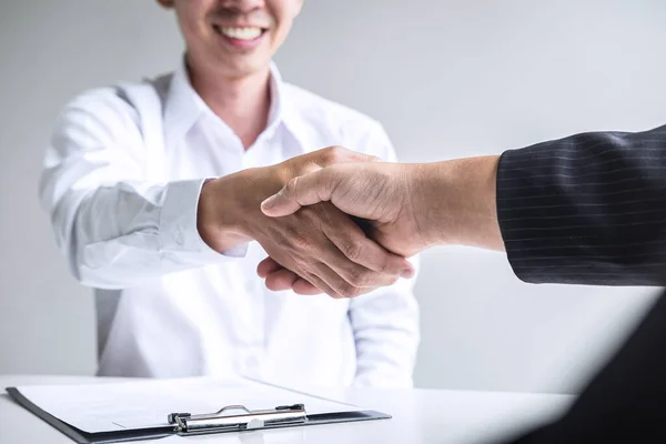 Successful job interview, Boss employer in suit and new employee shaking hands after negotiation and interview, career and placement concept.
