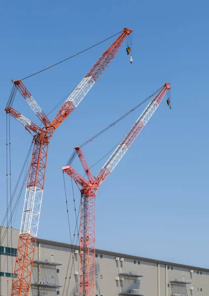 Red crane at construction site — Stock Photo, Image