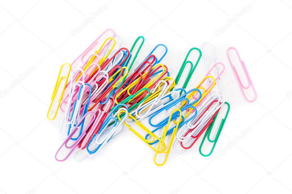 Colorful metal paper clips on white background