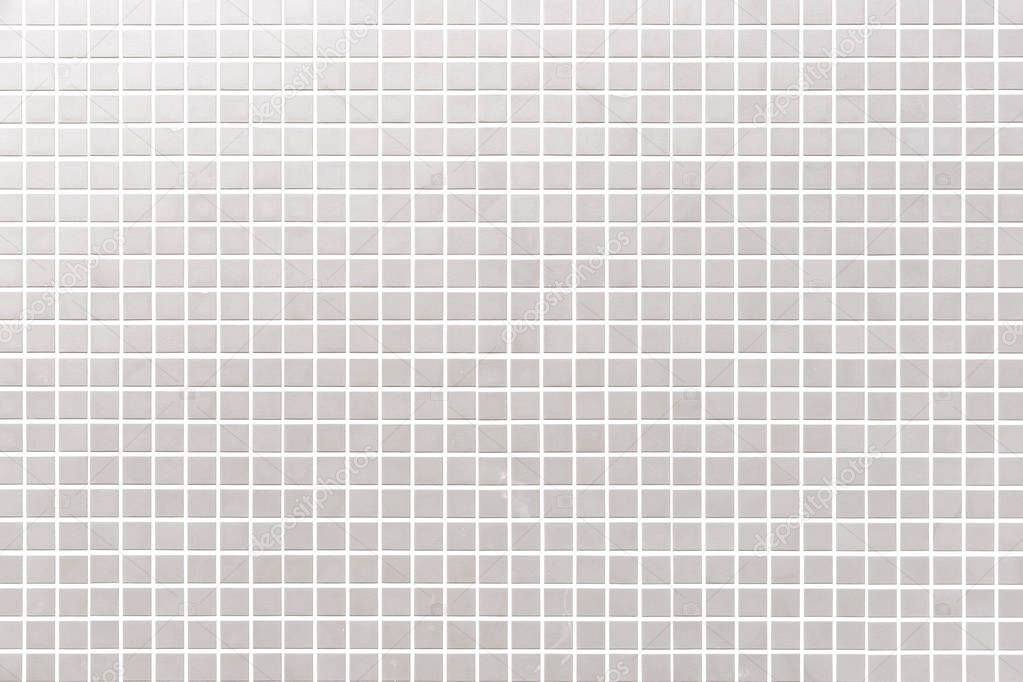 White mosaic tile wall pattern and seamless background 
