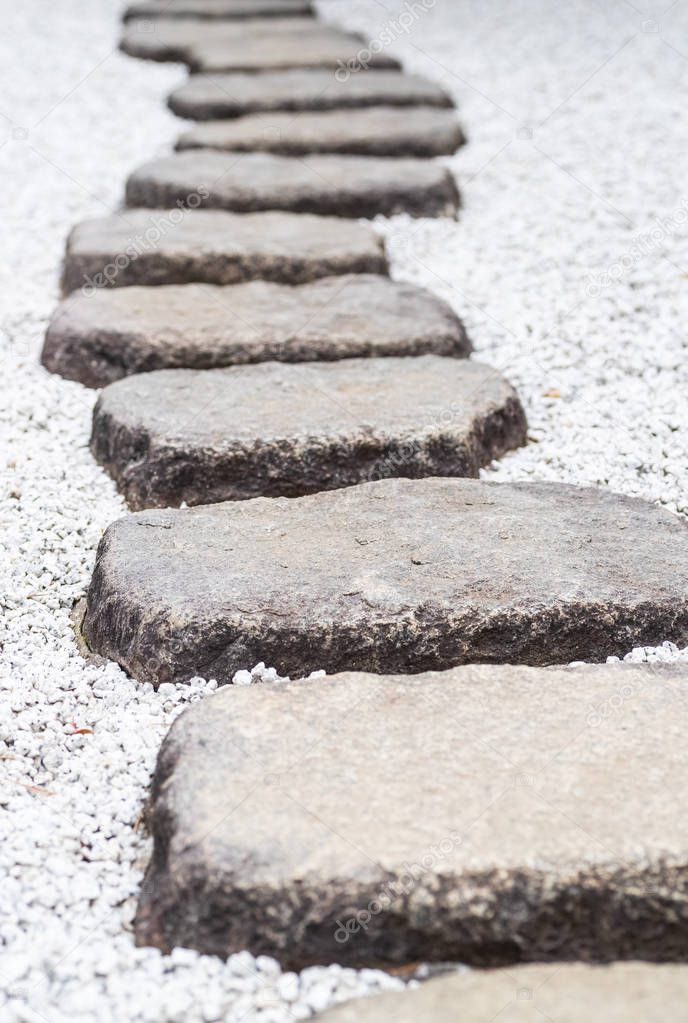 Stone Path of plated stones on gravel bed in Japanese Garden