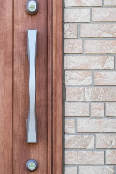 Metal door handle and wood door