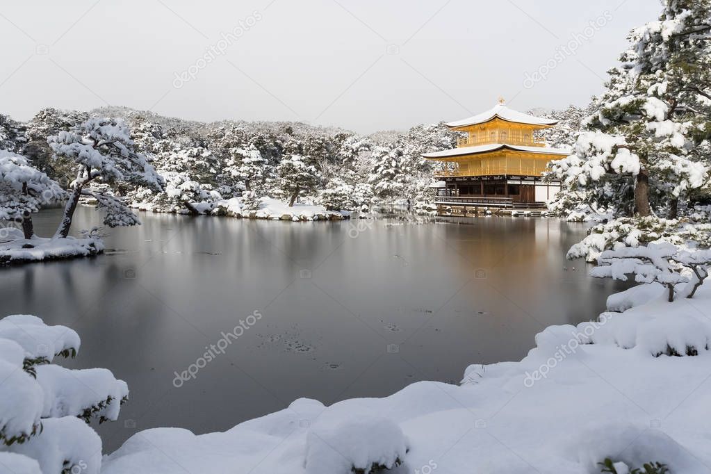 Zen temple Kinkakuji  with snow fall in winter