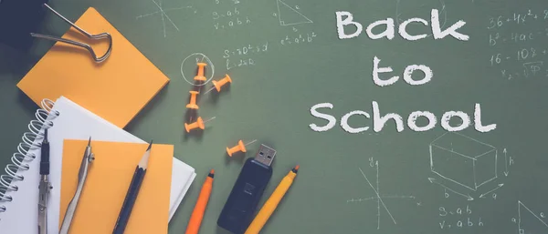 Back to school. Pattern of modern design with school supplies pencils, felt-tip pens, alarm clock, notebook and the words \