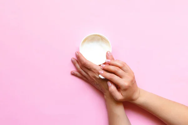 Woman Hands Moisturizing Cosmetic Cream Lotion Pink Background Copy Space Royalty Free Stock Images